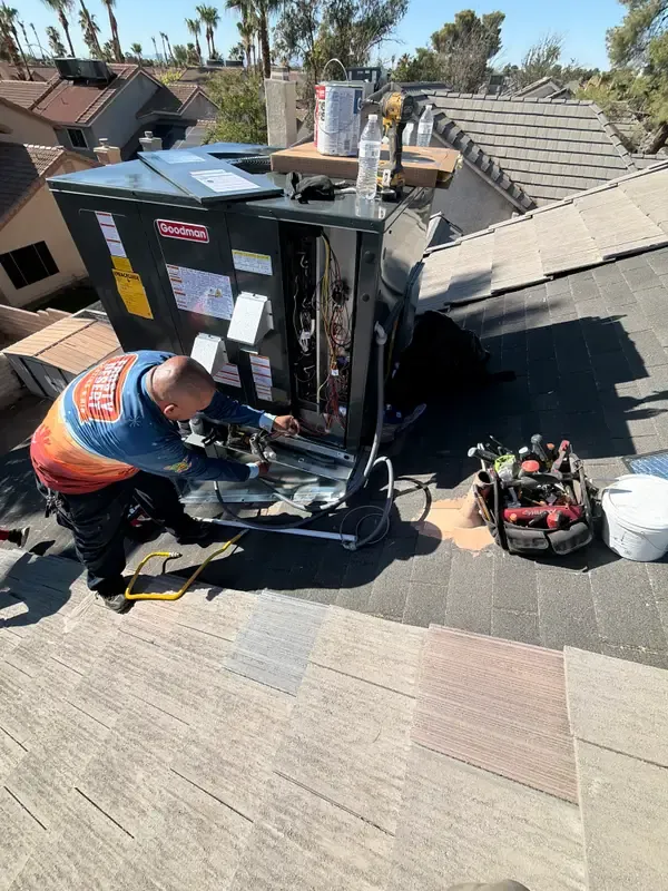 Frosty Desert technician servicing a rooftop AC unit in Las Vegas