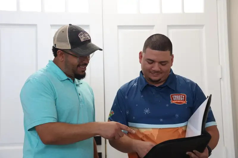 Frosty Desert technician explaining options to a homeowner